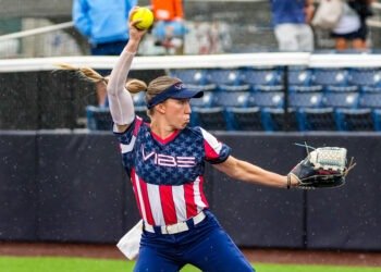 Softball player pitches