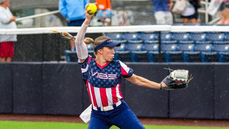 Softball player pitches